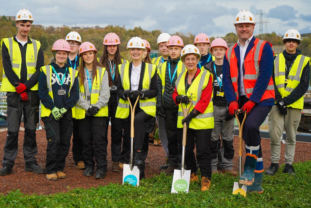 Mayor of Calderdale, Cllr Jane Scullion, Calderdale College students and Wilmott Dixon representatives with spades at Halifax bus station