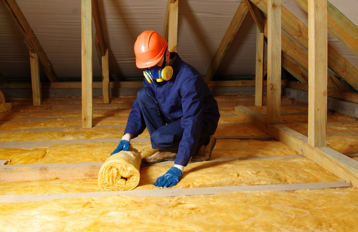 Loft insulation being fitted by an expert