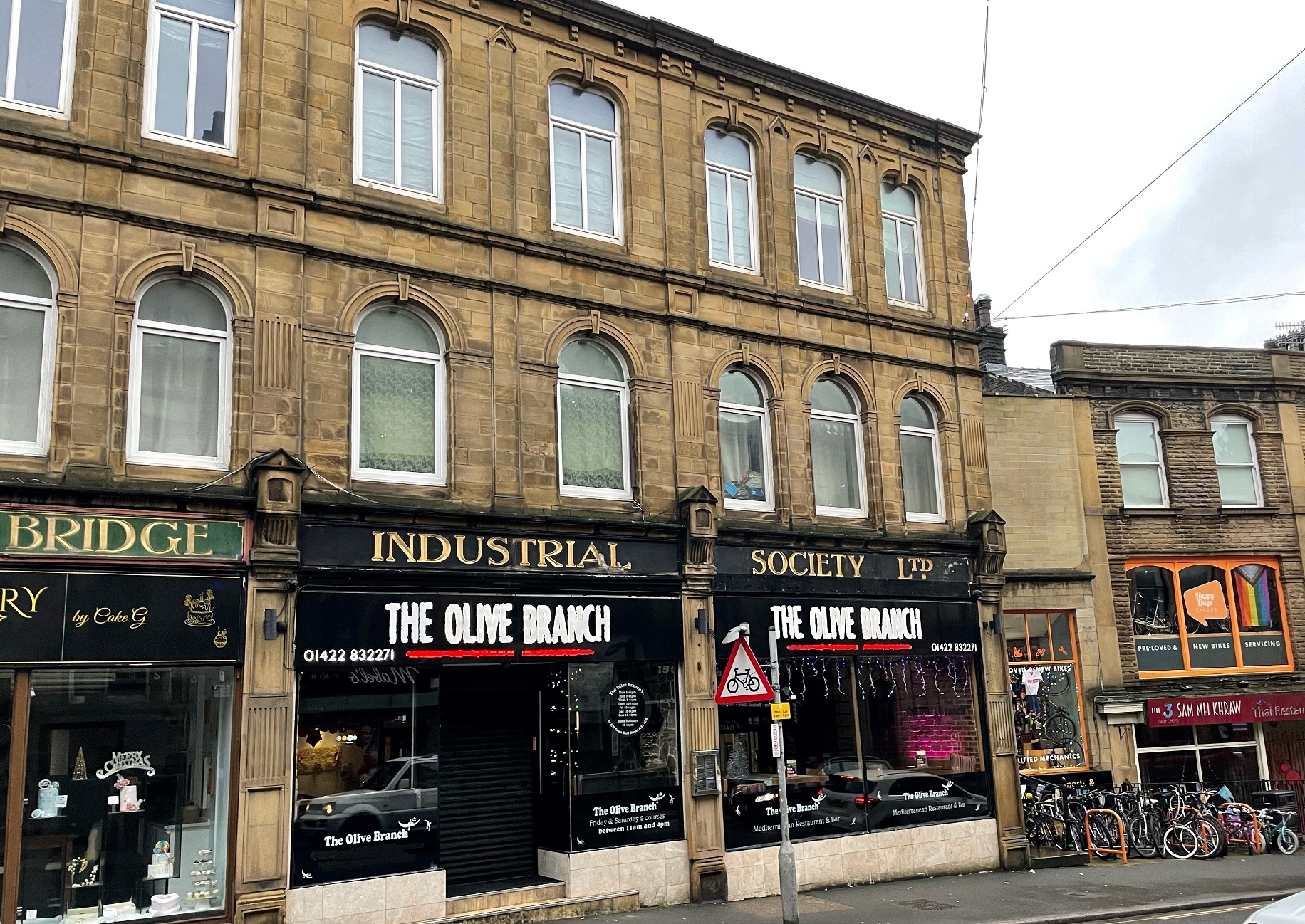 Olive Branch restaurant in Sowerby Bridge with heritage sign revealed