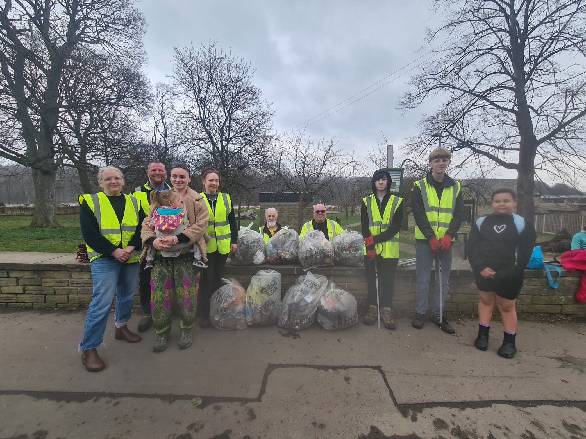 A group gathered with rubbish bags after supporting the Great British Spring Clean at Wellholme Park Brighouse