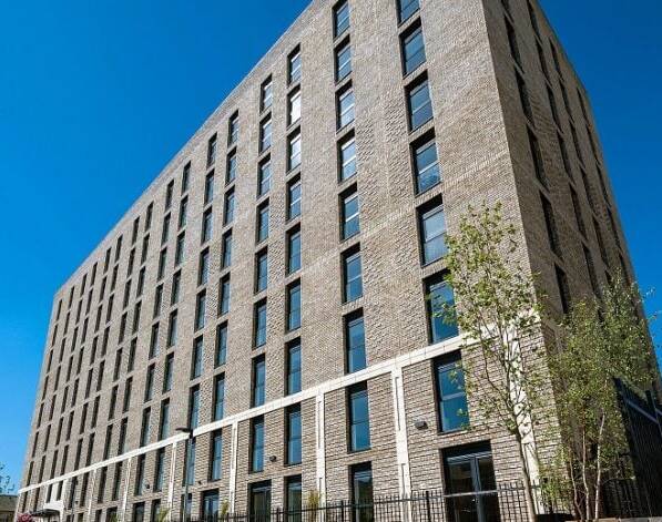 Outside the new Bolt Works 122-home scheme in Halifax town centre