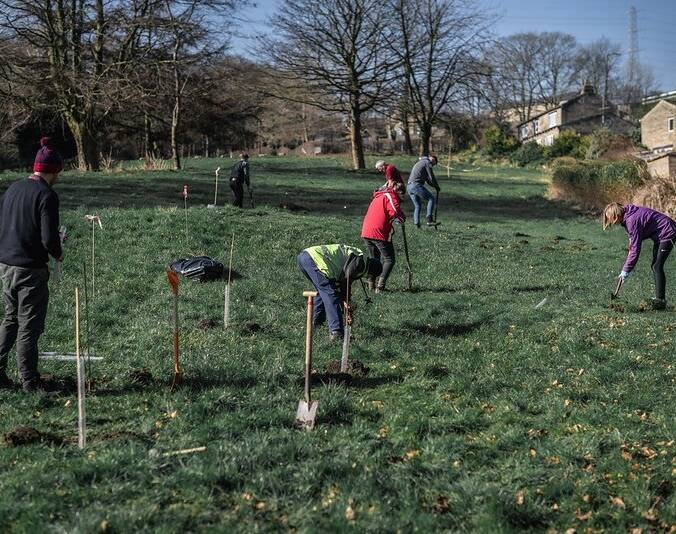 Volunteers planting trees at Shibden