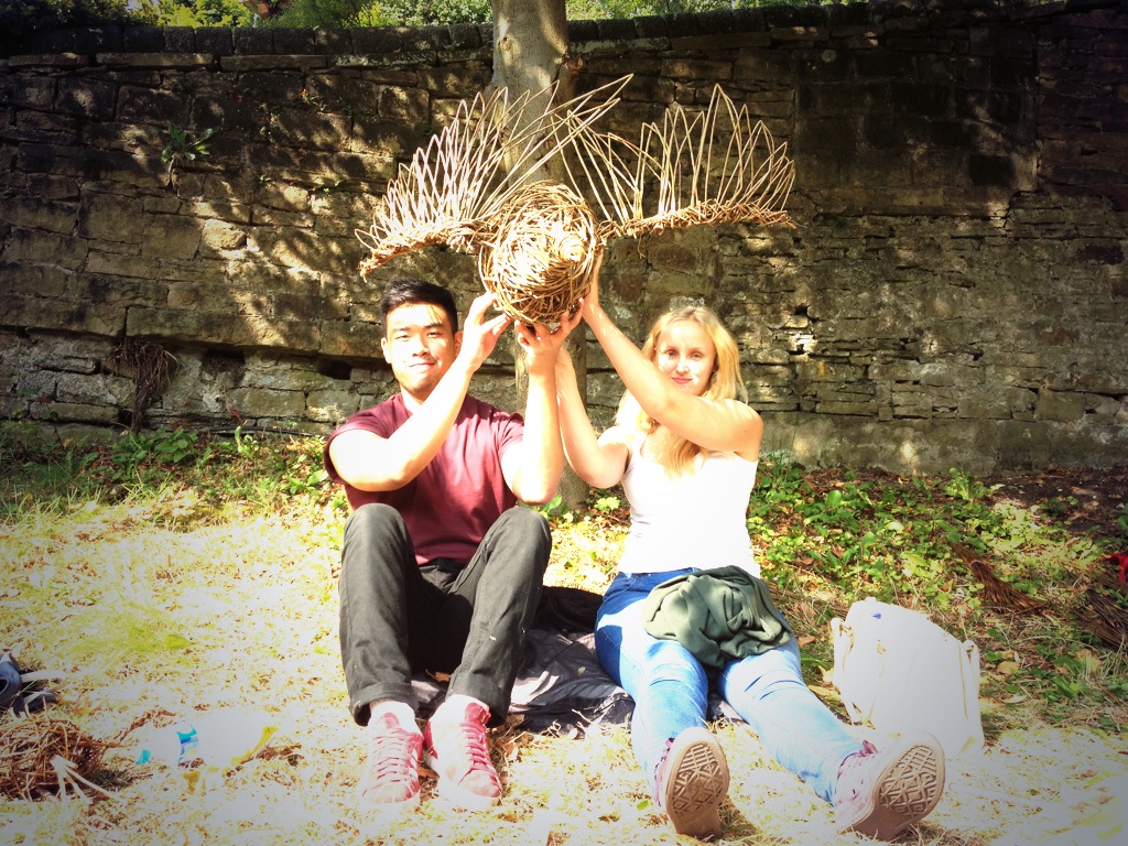 Volunteers with goose sculpture