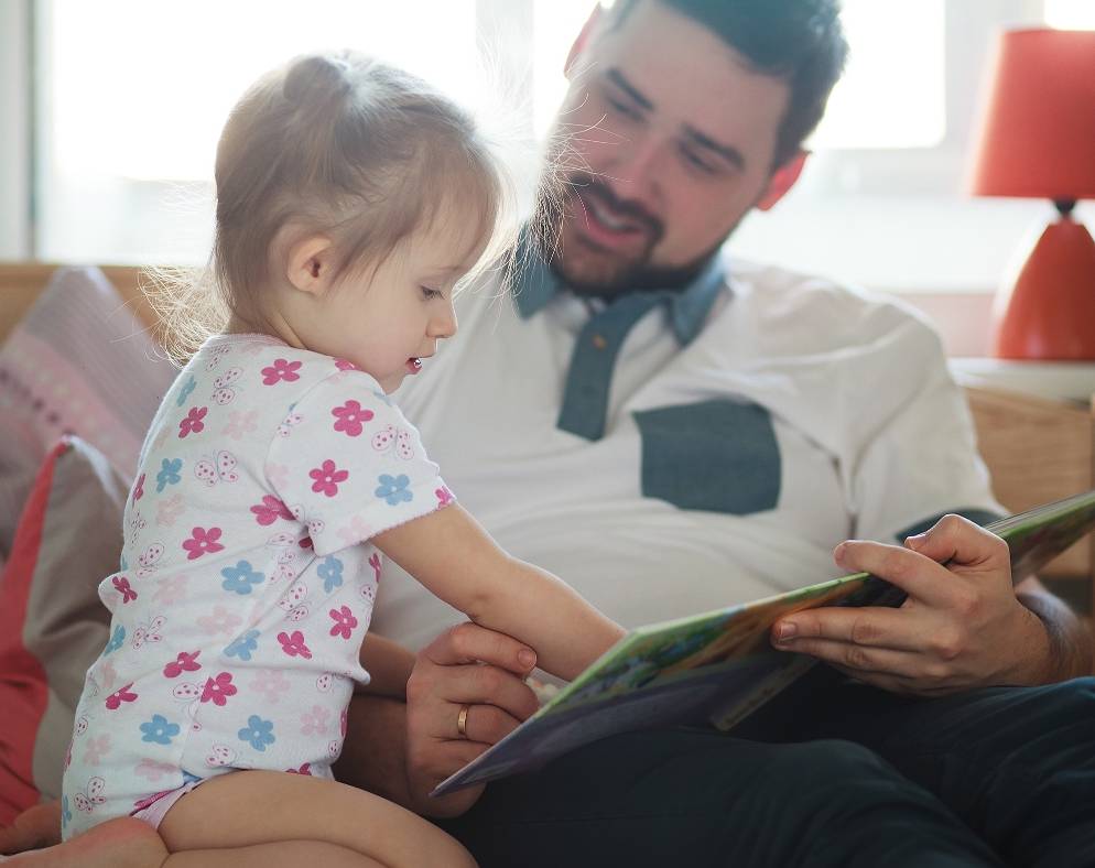 Father reading to baby