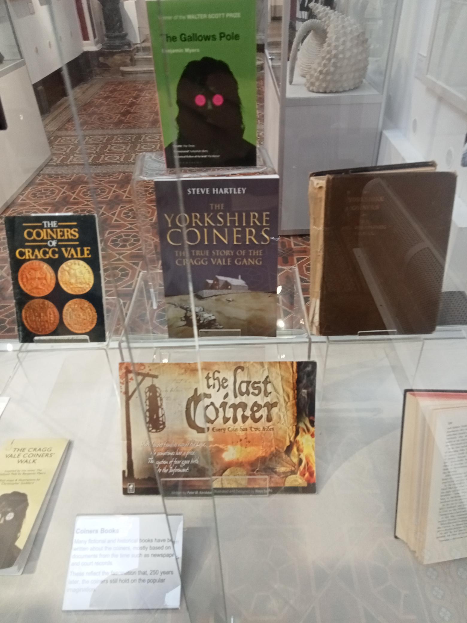 Display of books relating to the Cragg Vale Coiners at Bankfield Museum