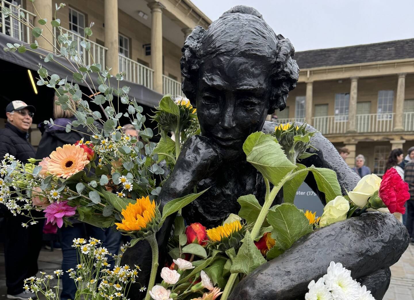 Anne Lister sculpture with flowers