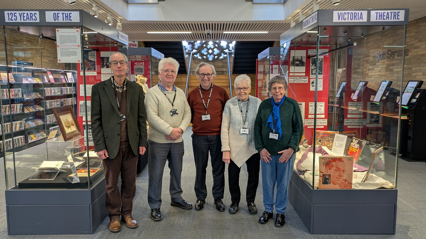 Friends group with display cases at Halifax Central LIbrary