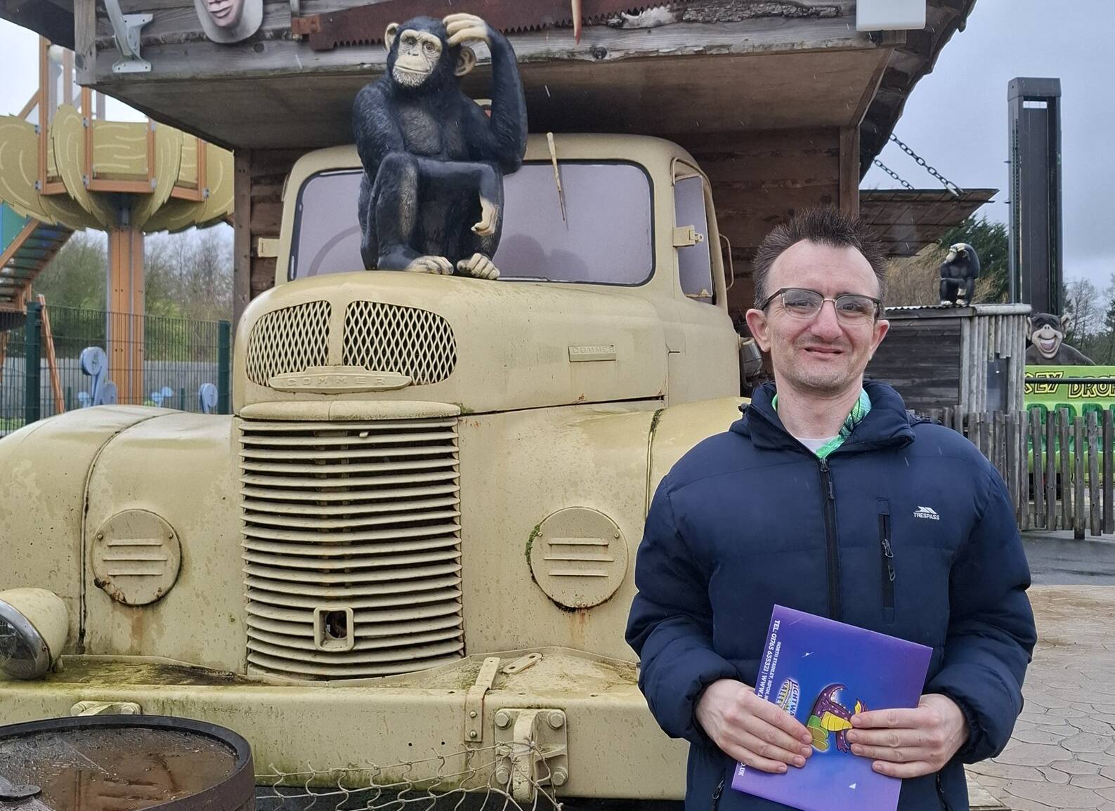 Man stood in front of car and house