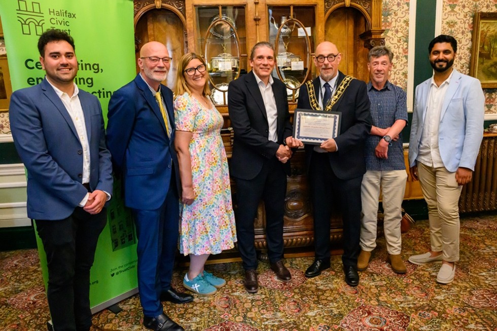 Group shot with Mayor presenting Halifax Civic Trust award to team involved with transformation of Halifax Borough Market